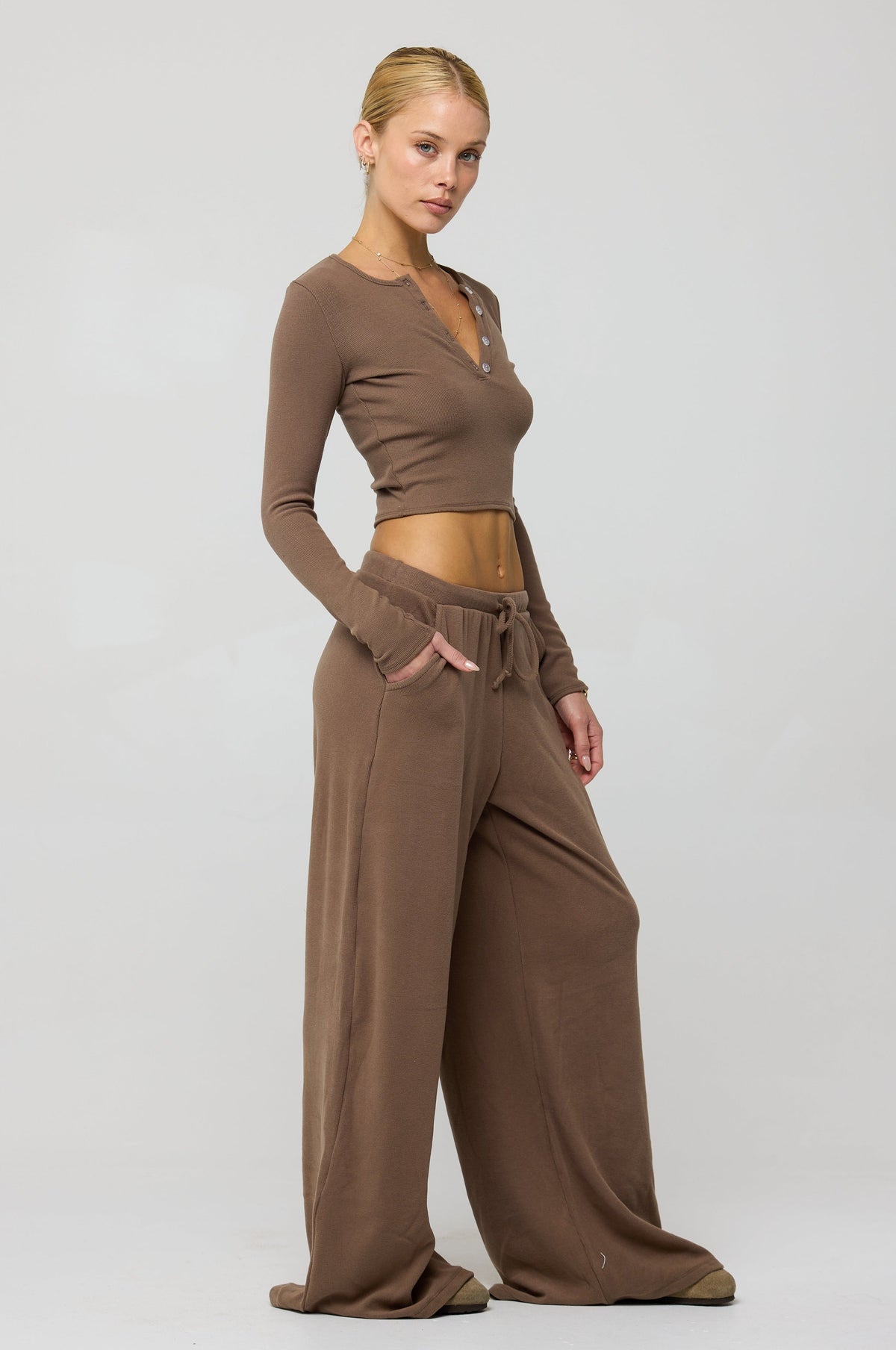 This is an image of Chase Rib Pant in Chai - RESA featuring a model wearing the dress