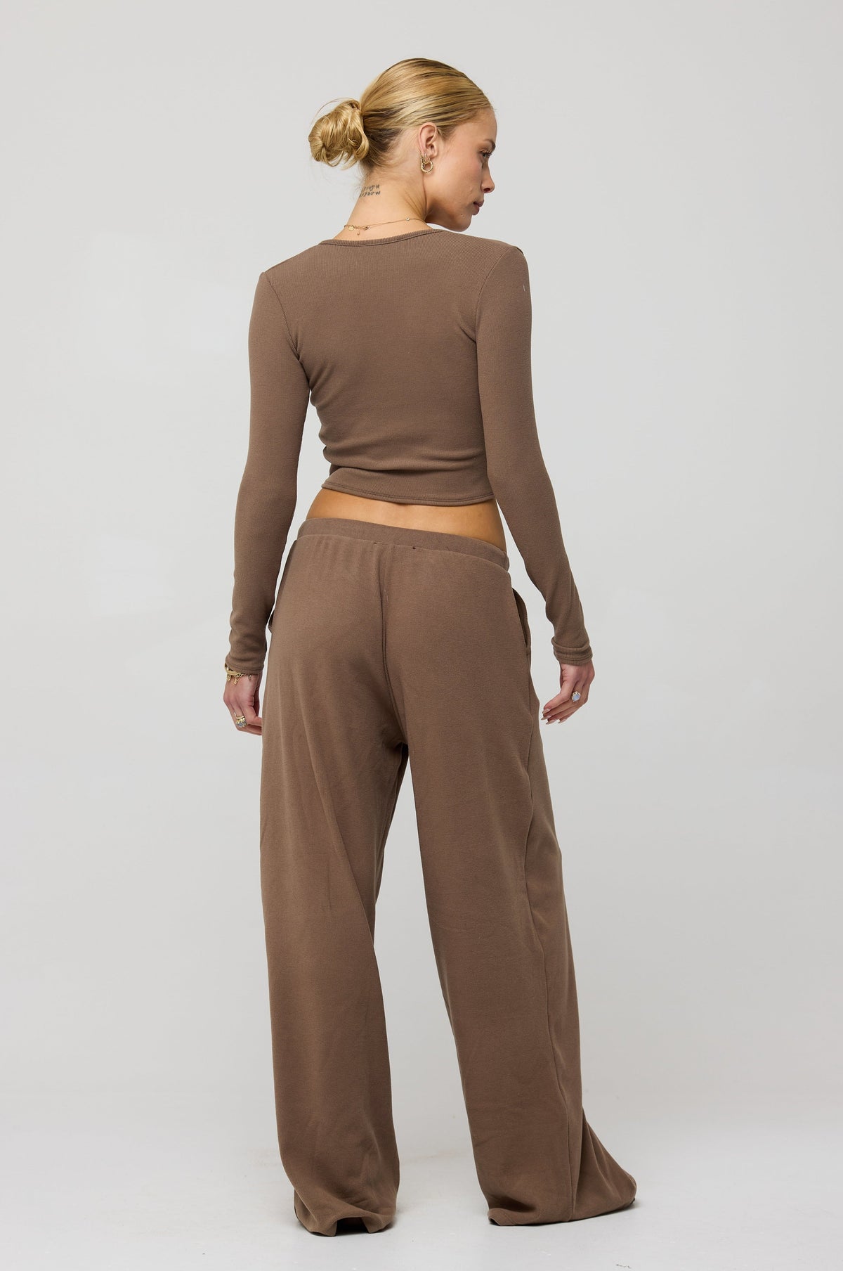 This is an image of Chase Rib Pant in Chai - RESA featuring a model wearing the dress