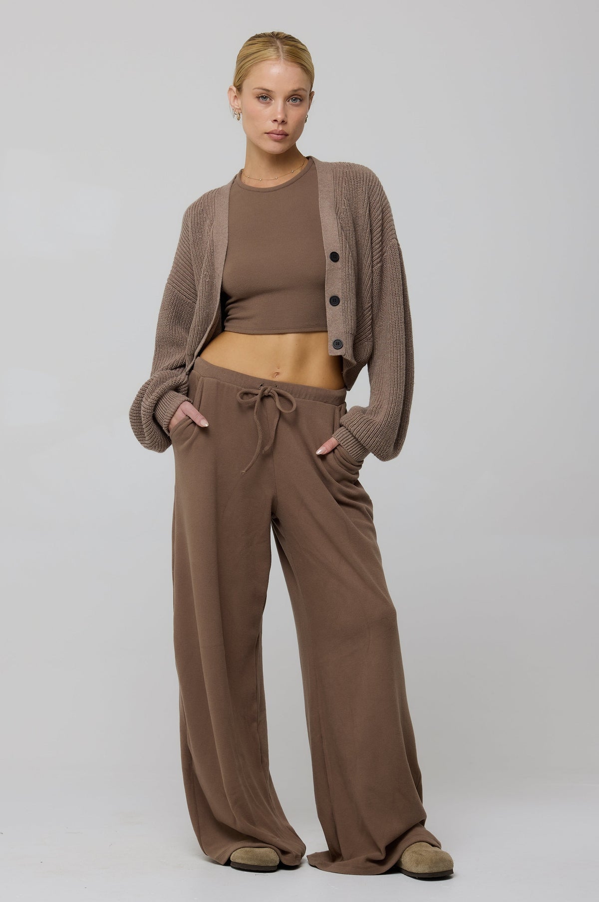 This is an image of Chase Rib Pant in Chai - RESA featuring a model wearing the dress