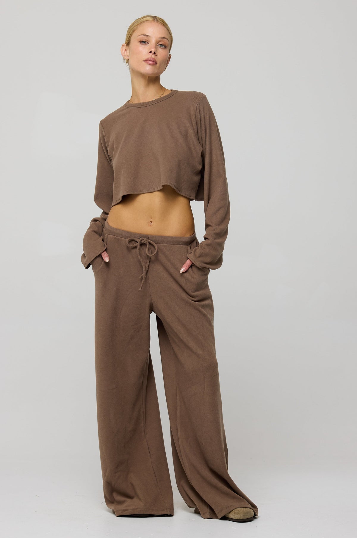 This is an image of Chase Rib Pant in Chai - RESA featuring a model wearing the dress