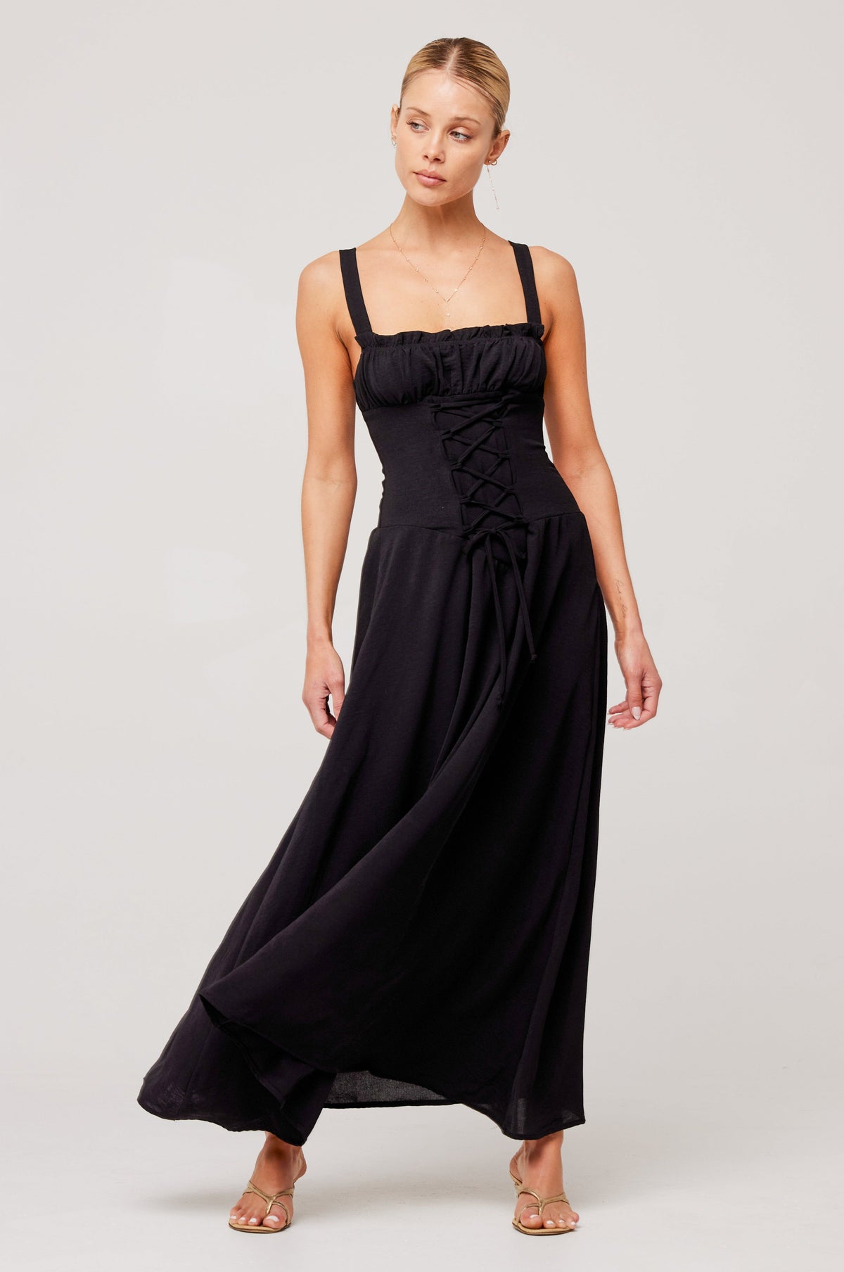 This is an image of Izzy Dress in Black - RESA featuring a model wearing the dress