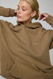 This is an image of Leo Hoodie in Moss - RESA featuring a model wearing the dress