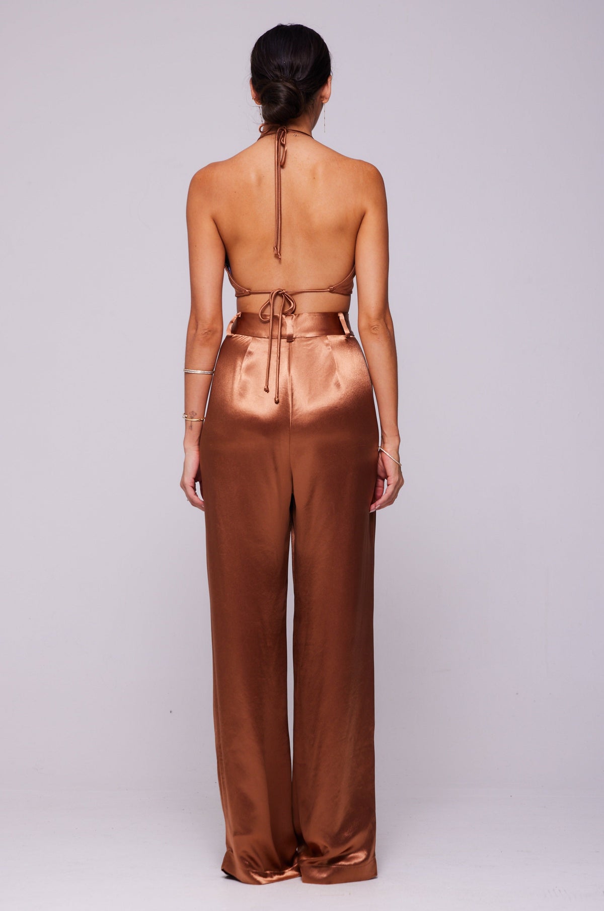 This is an image of Sasha Trouser in Copper - RESA featuring a model wearing the dress