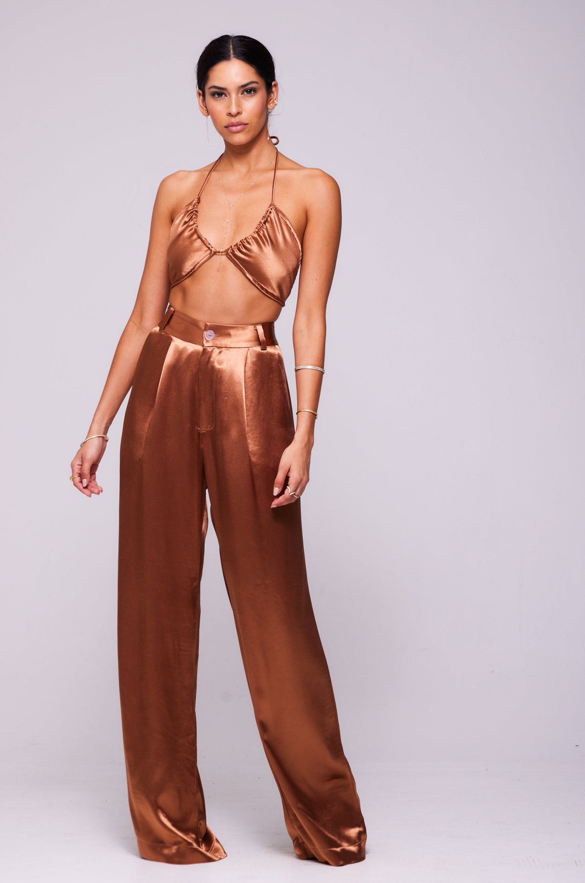 This is an image of Sasha Trouser in Copper - RESA featuring a model wearing the dress