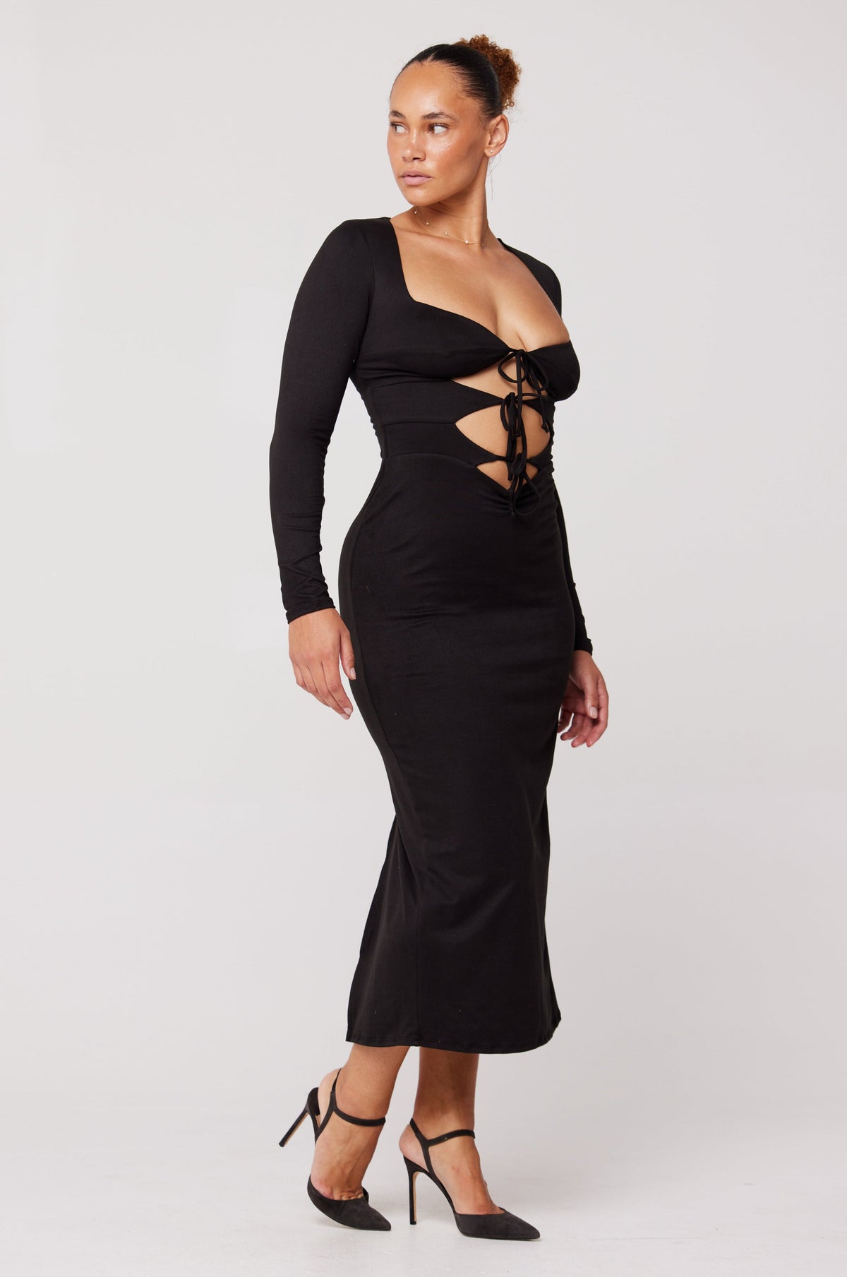 This is an image of Simone Dress in Black - RESA featuring a model wearing the dress