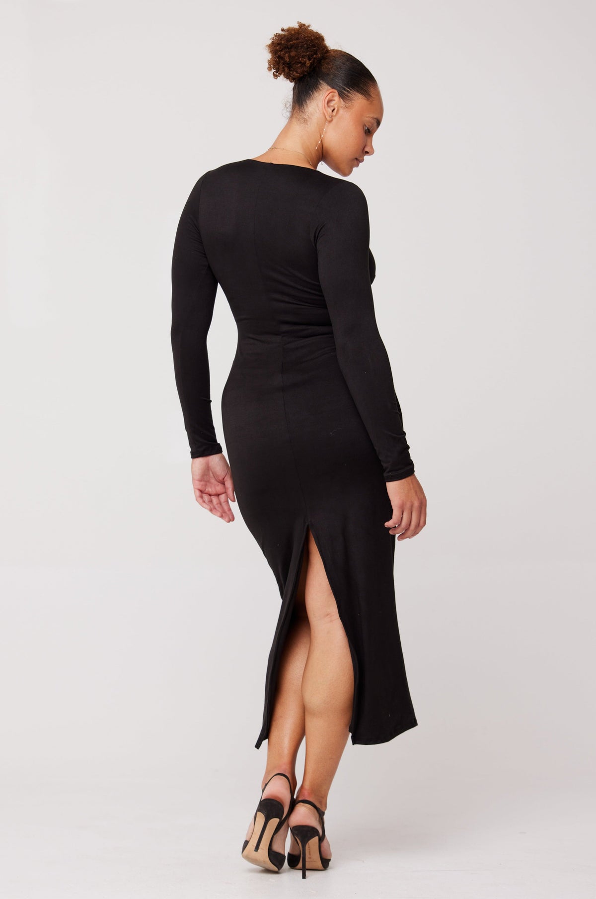 This is an image of Simone Dress in Black - RESA featuring a model wearing the dress