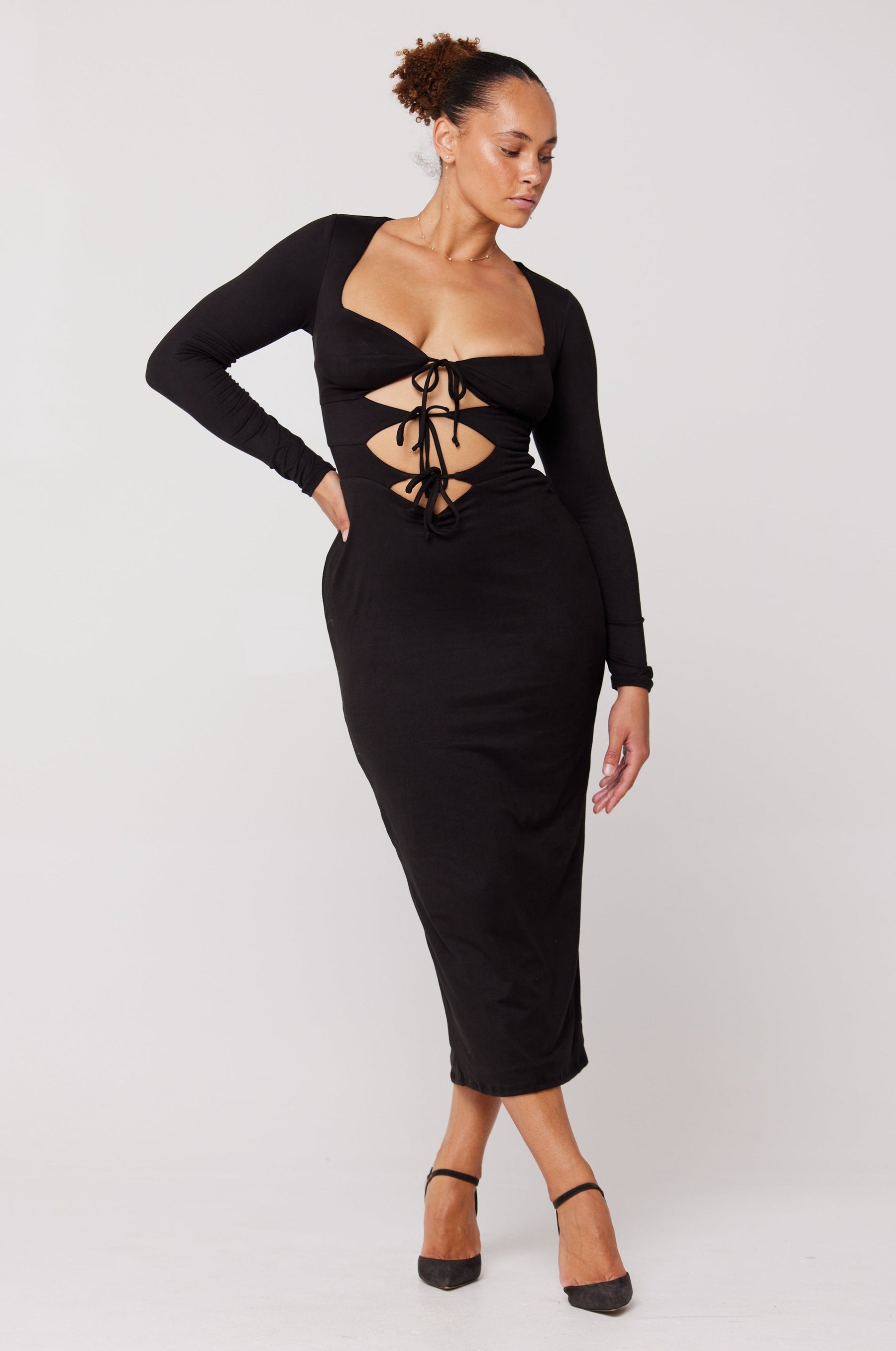 This is an image of Simone Dress in Black - RESA featuring a model wearing the dress