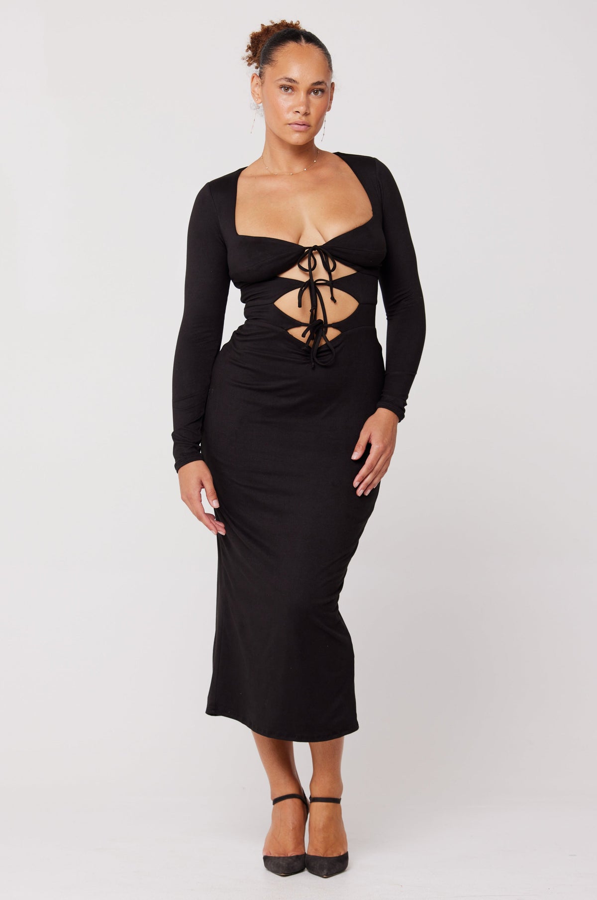 This is an image of Simone Dress in Black - RESA featuring a model wearing the dress