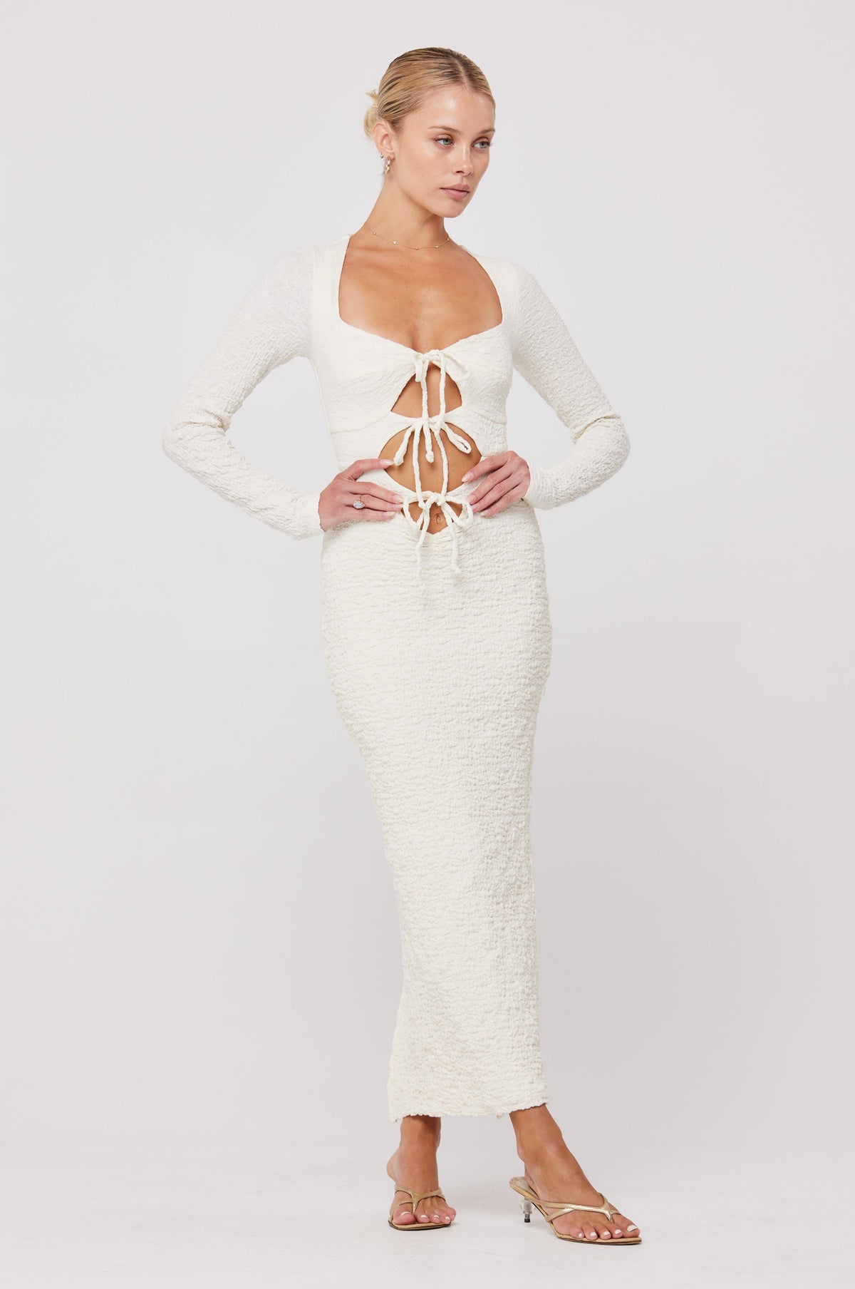 This is an image of Simone Dress in Ivory - RESA featuring a model wearing the dress