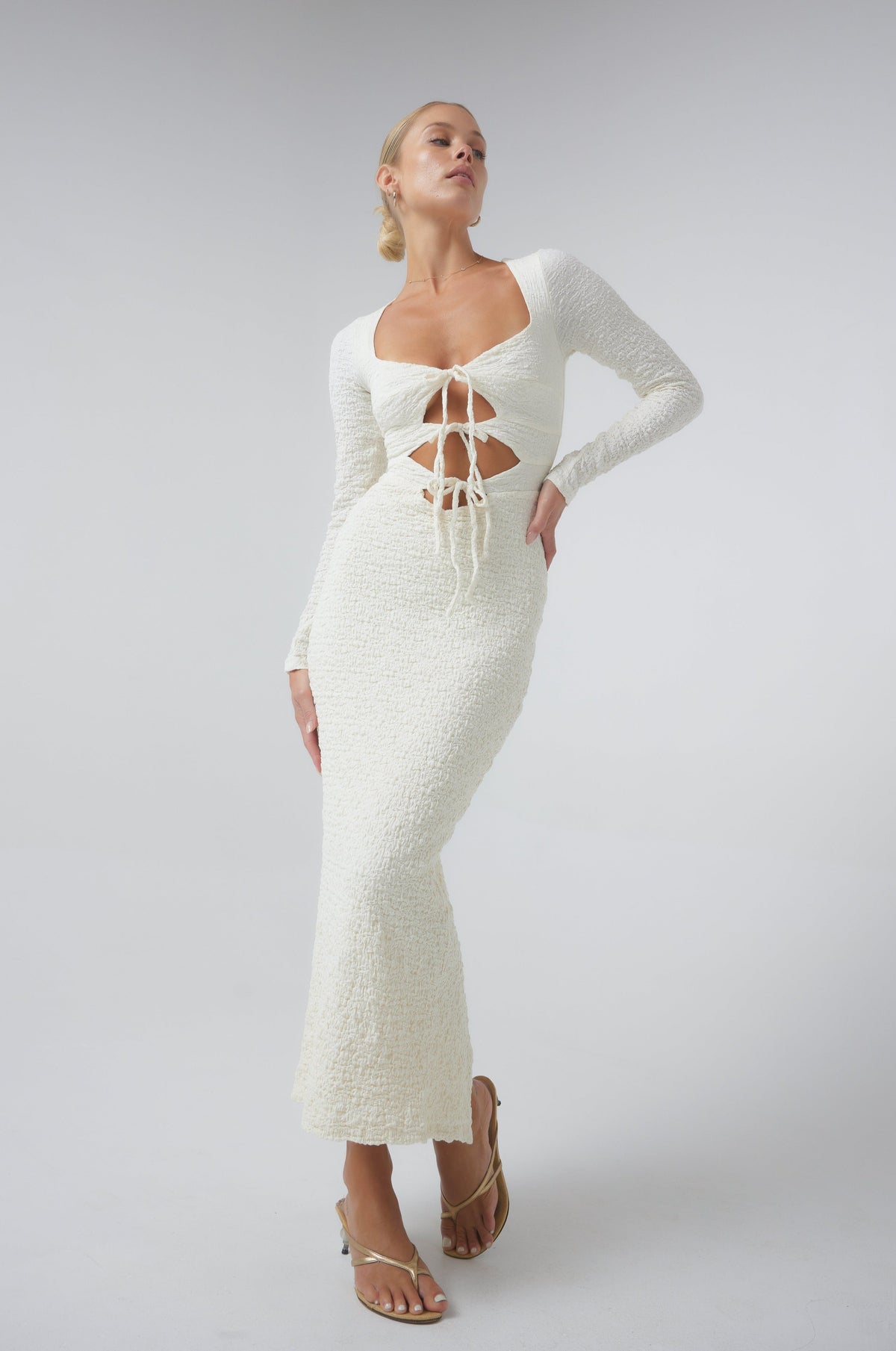 This is an image of Simone Dress in Ivory - RESA featuring a model wearing the dress