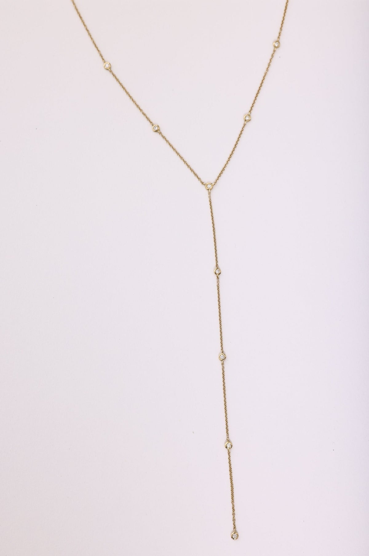 This is an image of Suzanne's Lariat - RESA featuring a model wearing the dress