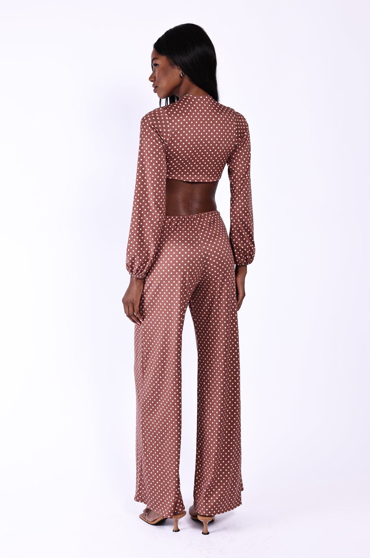 This is an image of Zoe Jumpsuit - RESA featuring a model wearing the dress